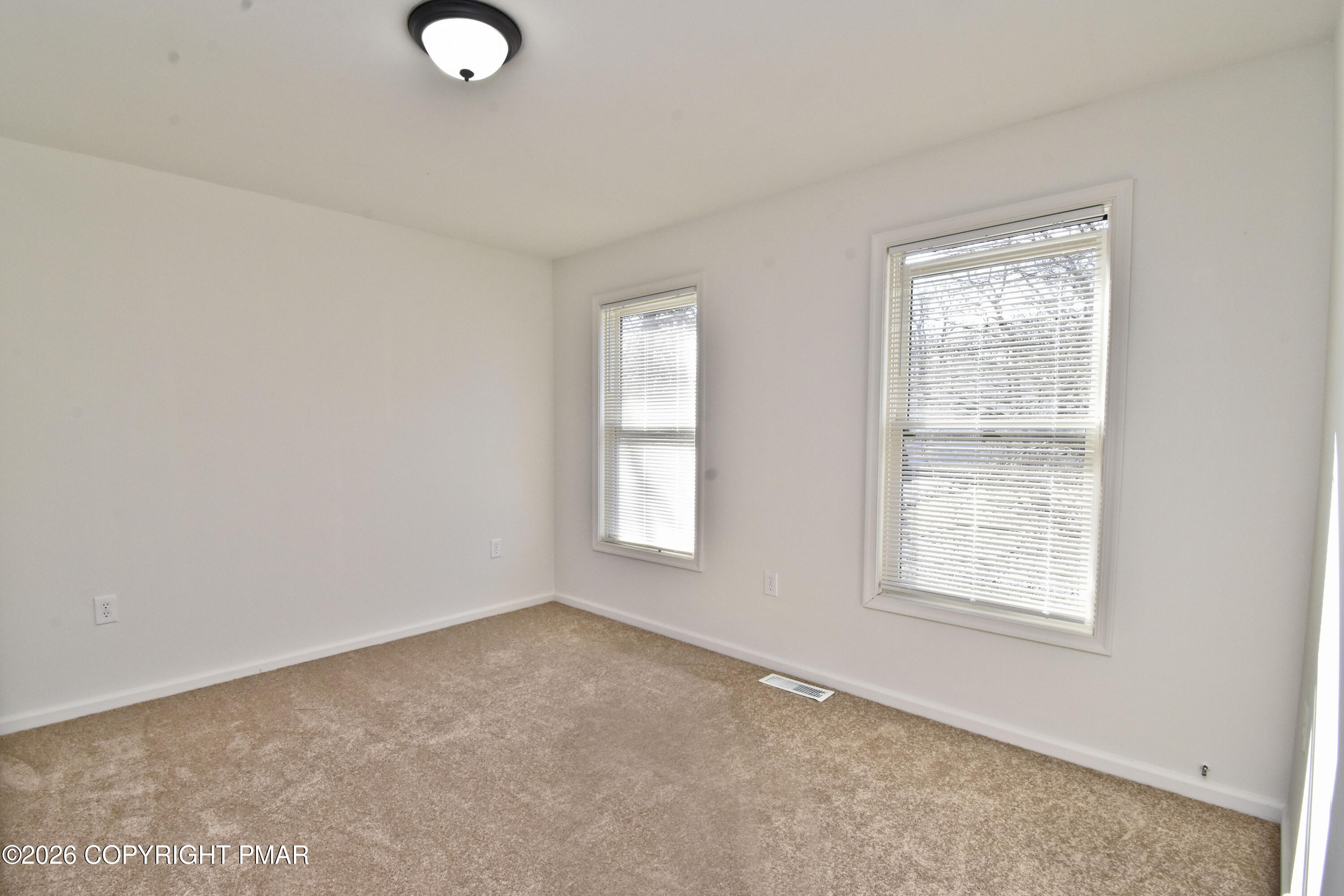 108 Pipher Road Bushkill, PA 18324 - Photo 31 of 50 an empty room with windows