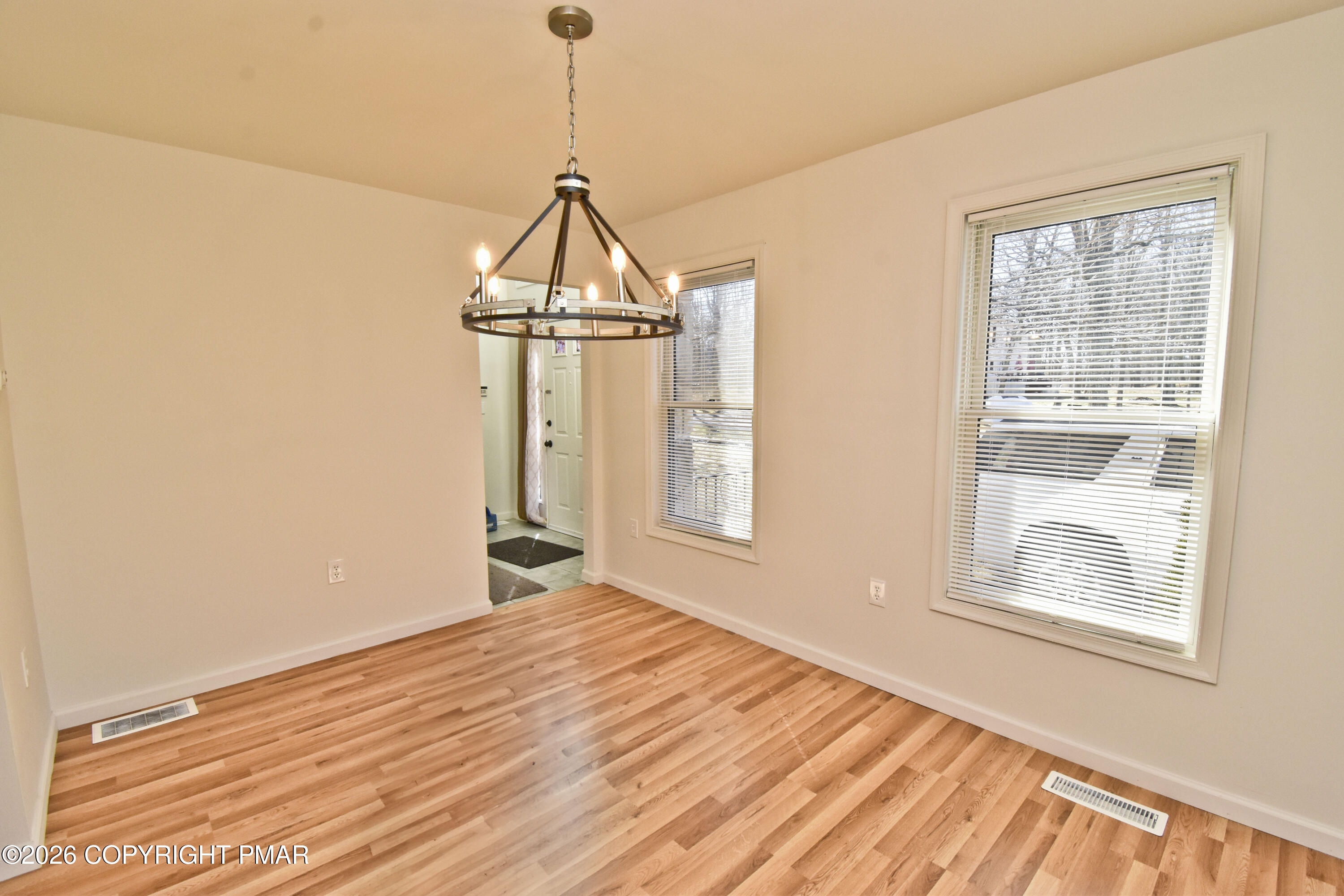 108 Pipher Road Bushkill, PA 18324 - Photo 4 of 50 a view of empty room with wooden floor and fan