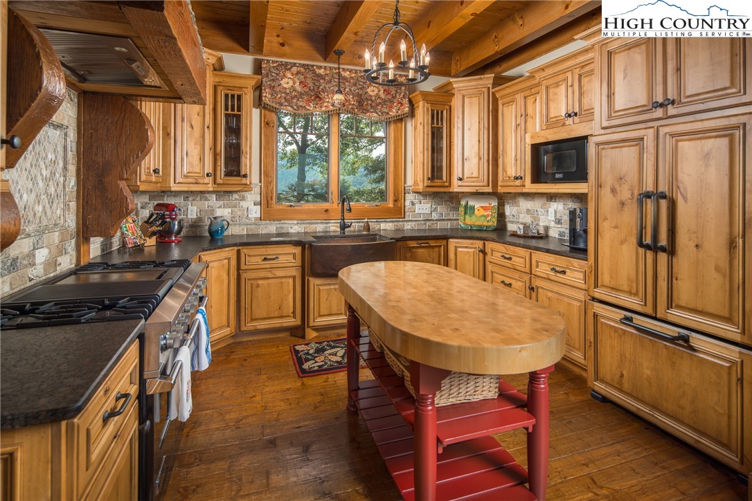 5212 Reynolds Parkway Boone, NC 28607 - Photo 11 of 50 a kitchen with stainless steel appliances granite countertop a sink stove and refrigerator