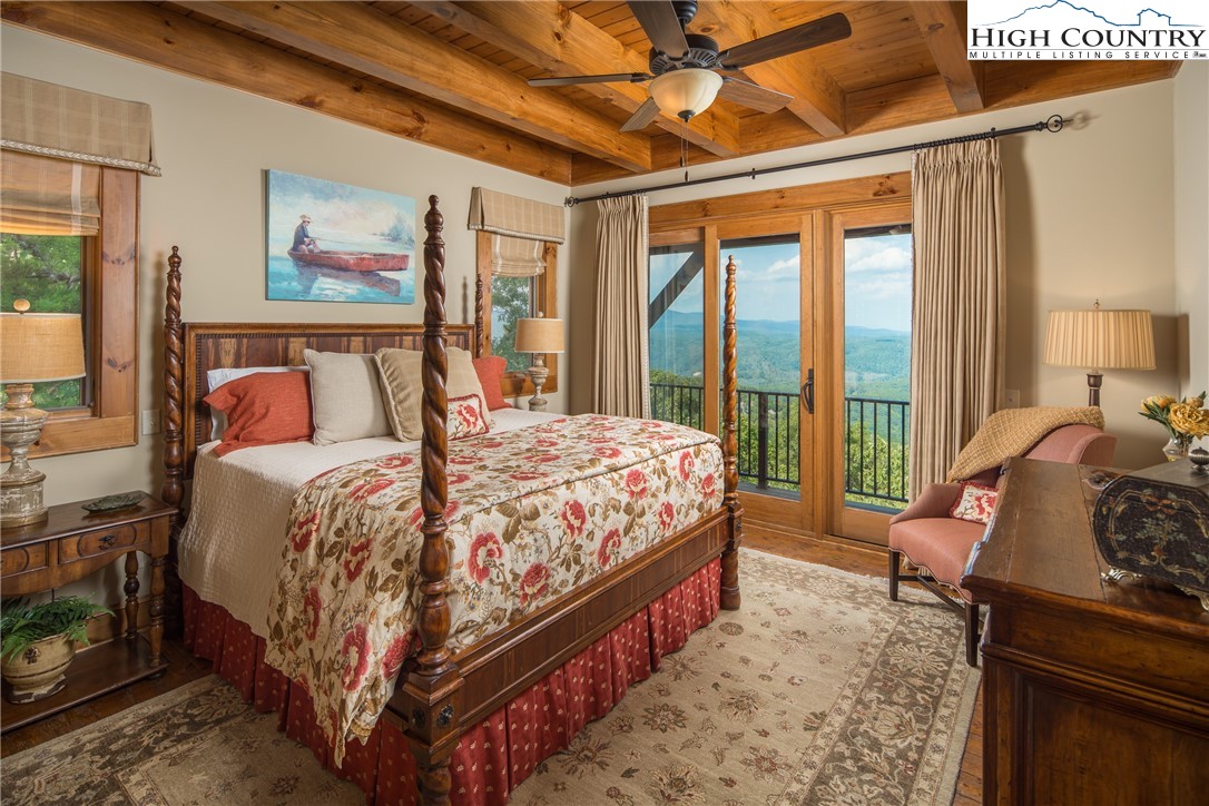 5212 Reynolds Parkway Boone, NC 28607 - Photo 14 of 50 a bed sitting in a bedroom next to a window