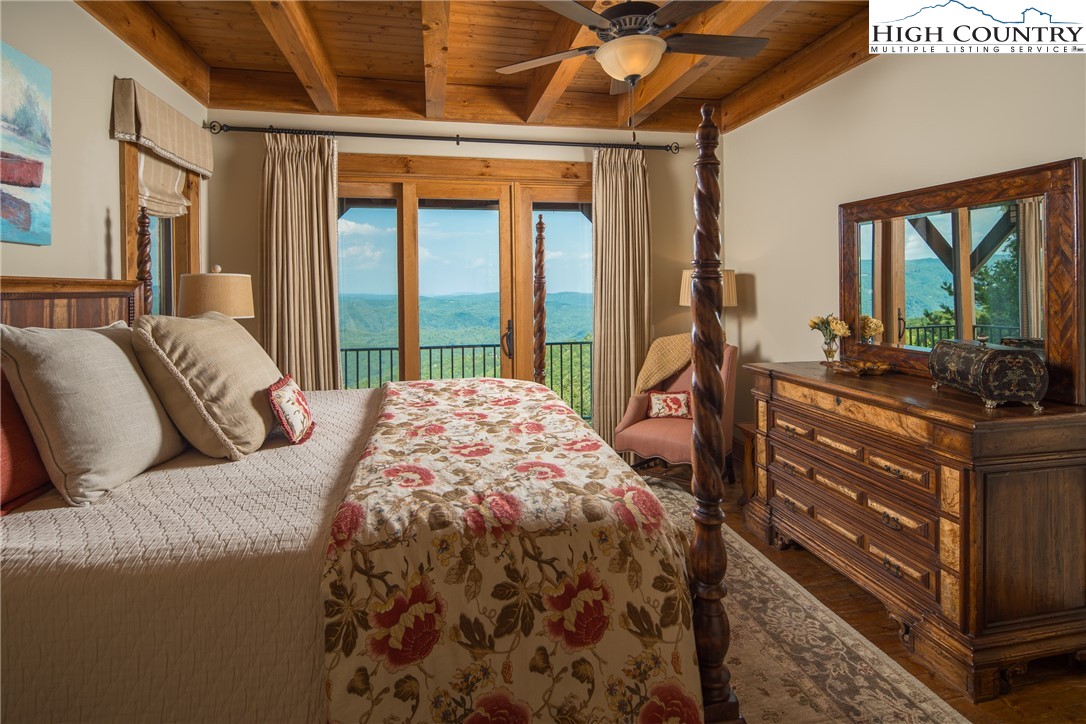 5212 Reynolds Parkway Boone, NC 28607 - Photo 15 of 50 a bed sitting in a bedroom next to a window