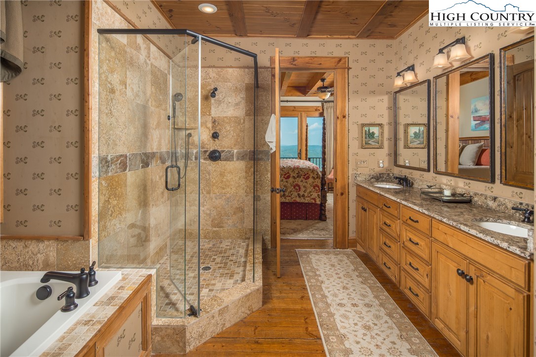 5212 Reynolds Parkway Boone, NC 28607 - Photo 17 of 50 a bathroom with a tub sink shower and mirror