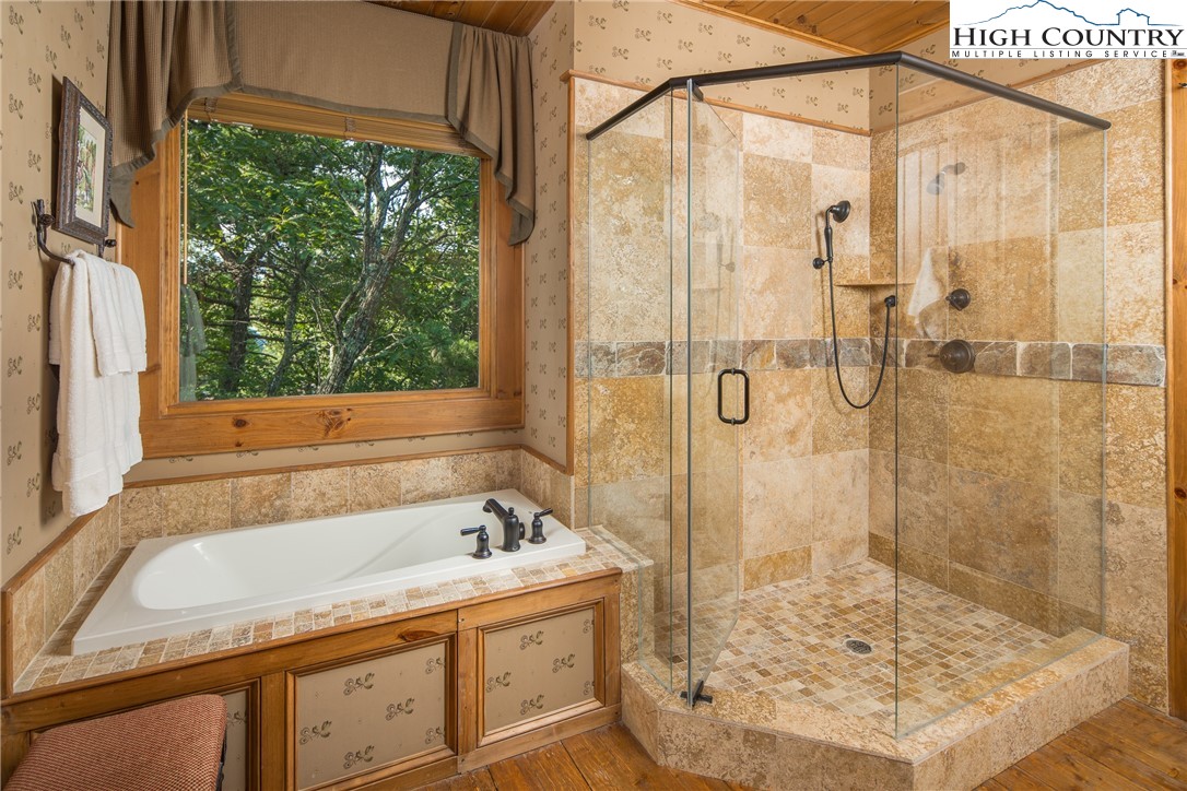 5212 Reynolds Parkway Boone, NC 28607 - Photo 18 of 50 a bathroom with a bath tub and shower