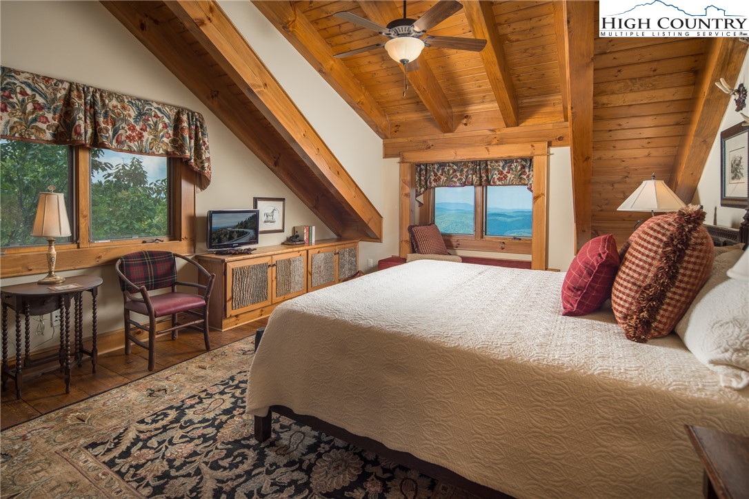 5212 Reynolds Parkway Boone, NC 28607 - Photo 23 of 50 a bed sitting in a bedroom next to a window