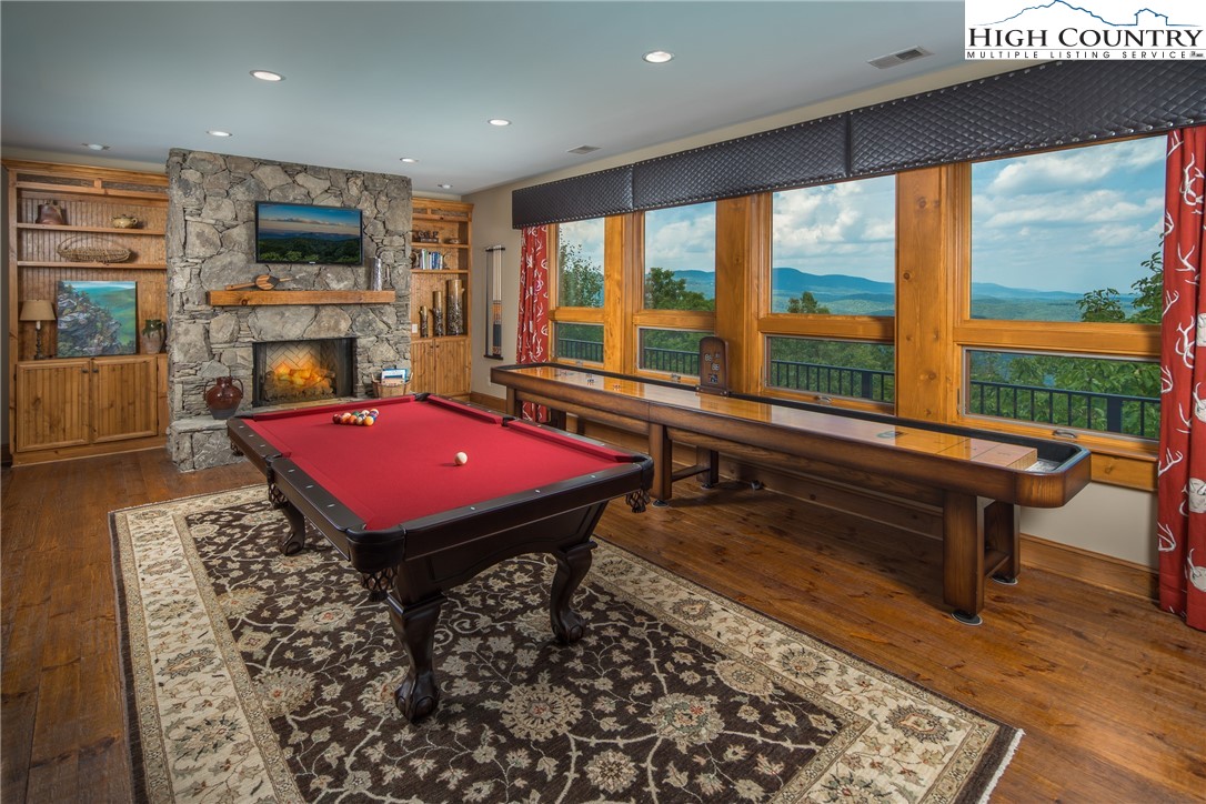 5212 Reynolds Parkway Boone, NC 28607 - Photo 29 of 50 a living room with pool table furniture and a flat screen tv