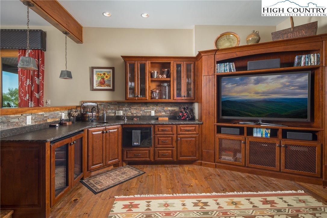 5212 Reynolds Parkway Boone, NC 28607 - Photo 34 of 50 a kitchen with stainless steel appliances granite countertop a stove and a sink