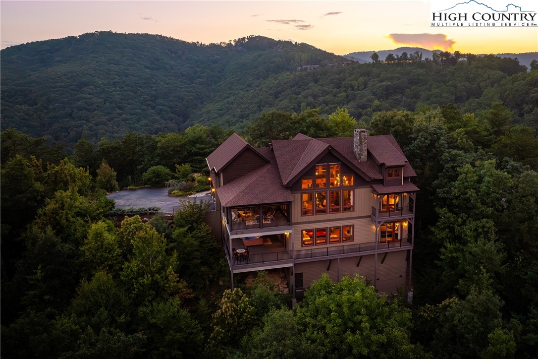 5212 Reynolds Parkway Boone, NC 28607 - Photo 49 of 50 a view of a big house with a big yard and mountain view