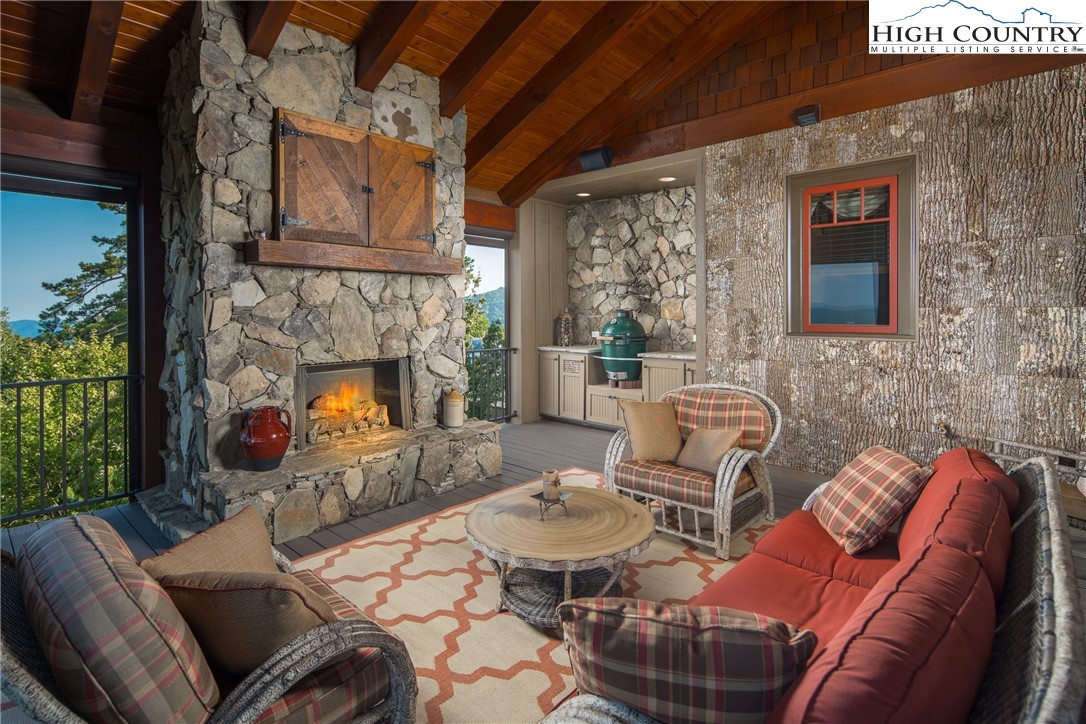 5212 Reynolds Parkway Boone, NC 28607 - Photo 10 of 50 a outdoor living space with furniture and a fireplace