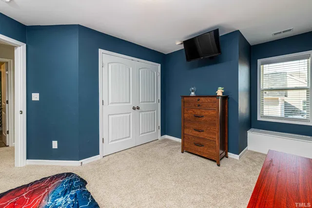 a bedroom with a bed and furniture