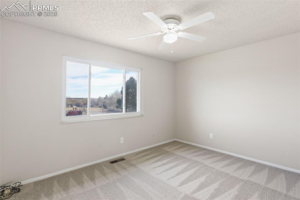 1620 Winnebago Road Colorado Springs, CO 80915 - Photo 11 of 25 an empty room with a window