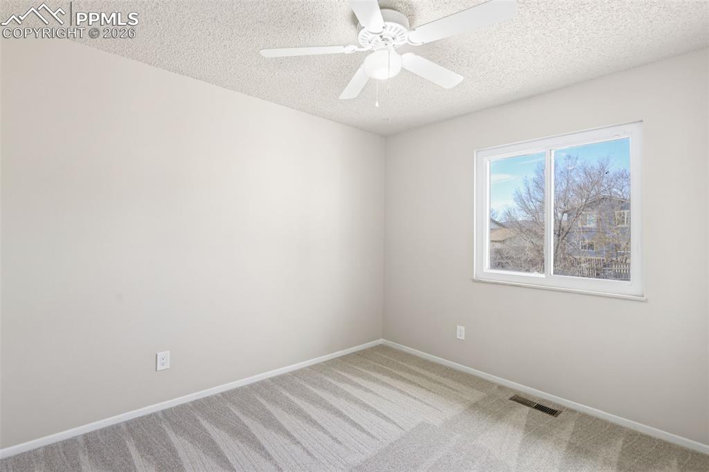 1620 Winnebago Road Colorado Springs, CO 80915 - Photo 13 of 25 an empty room with a window