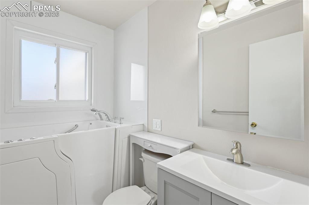 1620 Winnebago Road Colorado Springs, CO 80915 - Photo 15 of 25 a bathroom with a sink toilet vanity and tub