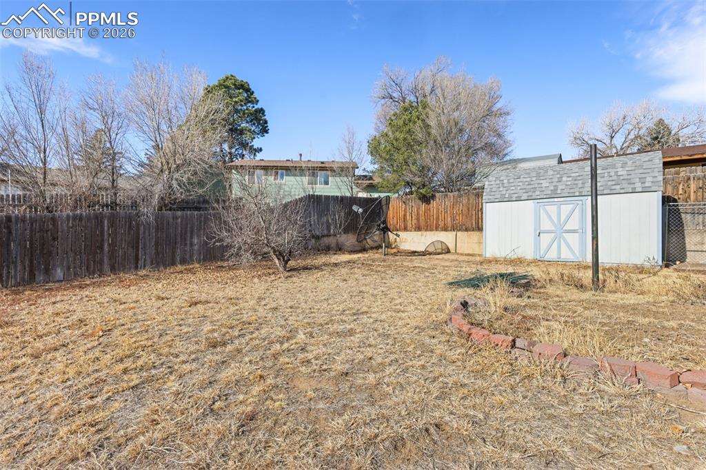 1620 Winnebago Road Colorado Springs, CO 80915 - Photo 20 of 25 a view of a backyard of a house