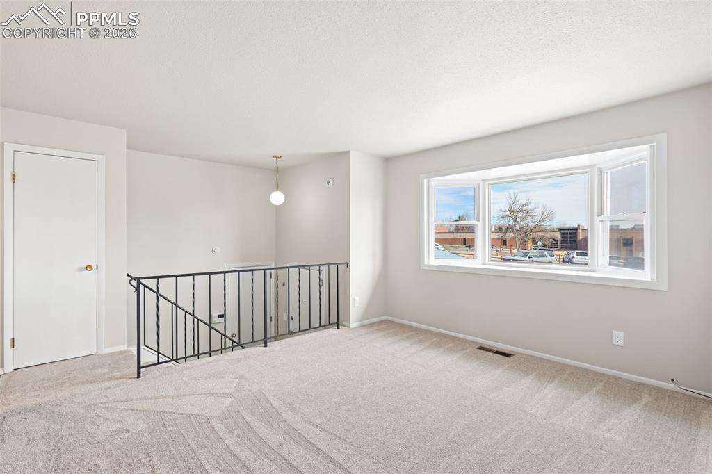 1620 Winnebago Road Colorado Springs, CO 80915 - Photo 3 of 25 a view of an empty room with a window