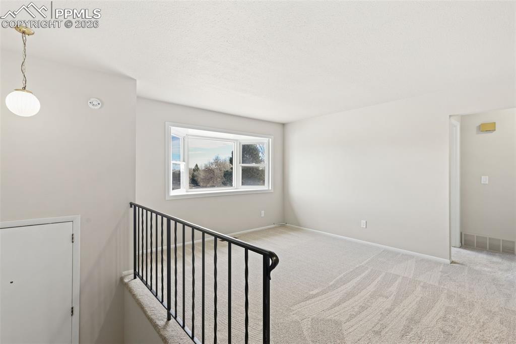1620 Winnebago Road Colorado Springs, CO 80915 - Photo 6 of 25 a view of empty room with wooden floor