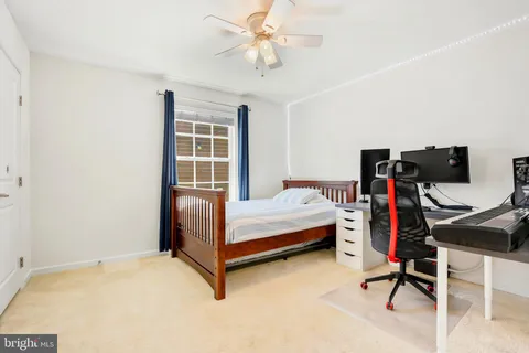 a bedroom with bed and a window
