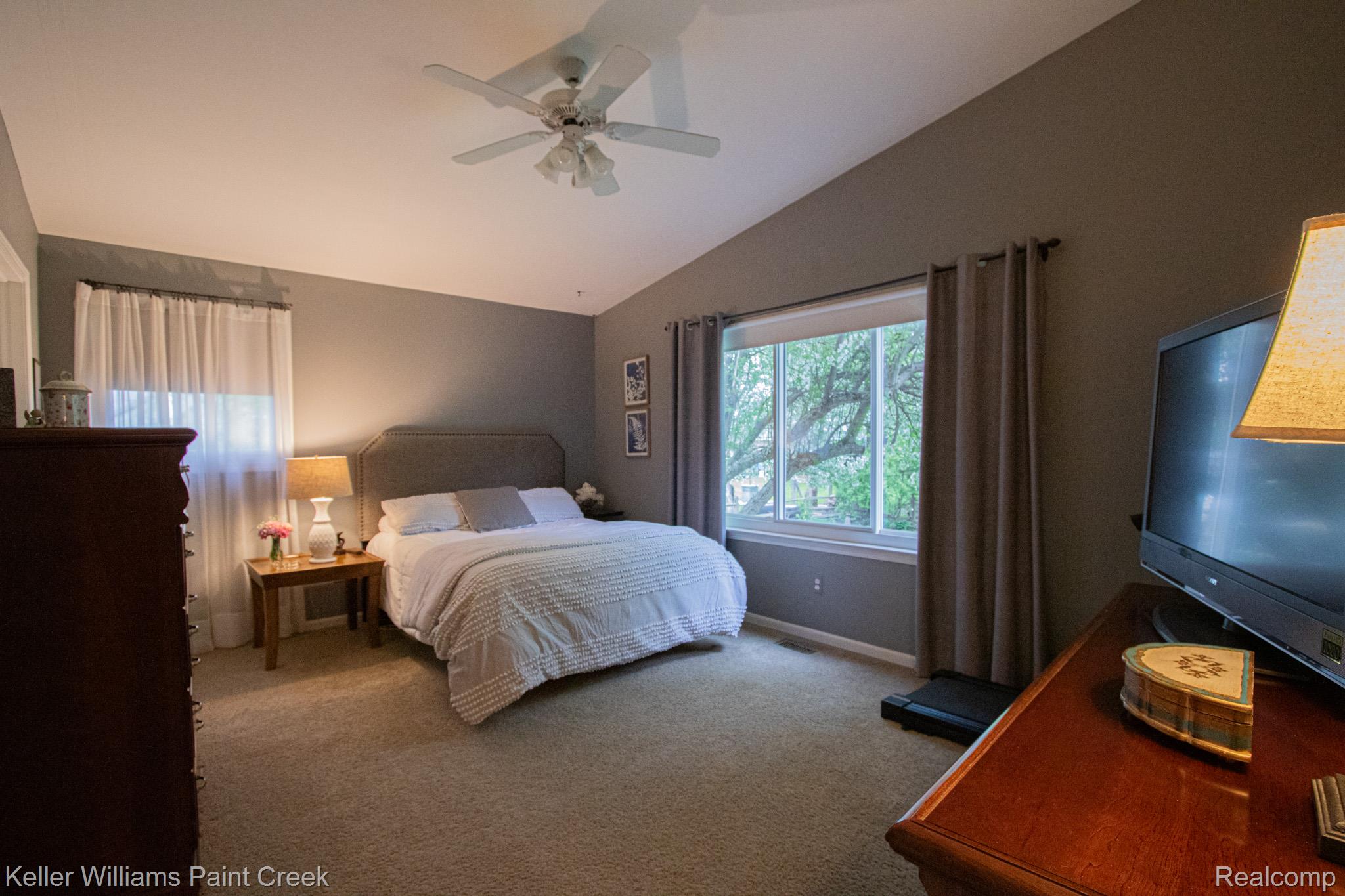 70696 Mellen Street Romeo, MI 48065 - Photo 17 of 46 Bedroom featuring carpet flooring, lofted ceiling, and ceiling fan