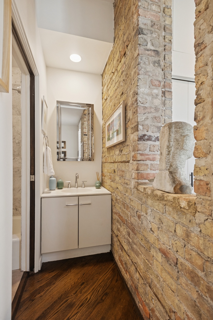 832 West Wolfram Street Chicago, IL 60657 - Photo 11 of 51 a bathroom with a sink and a mirror
