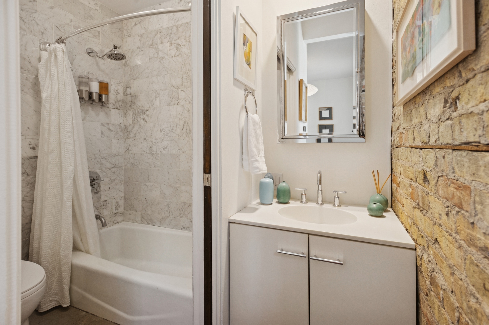 832 West Wolfram Street Chicago, IL 60657 - Photo 12 of 51 a bathroom with a sink mirror toilet and bathtub