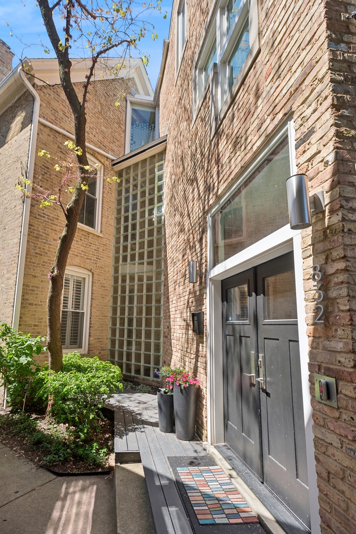 832 West Wolfram Street Chicago, IL 60657 - Photo 2 of 51 a view of a brick building next to a yard
