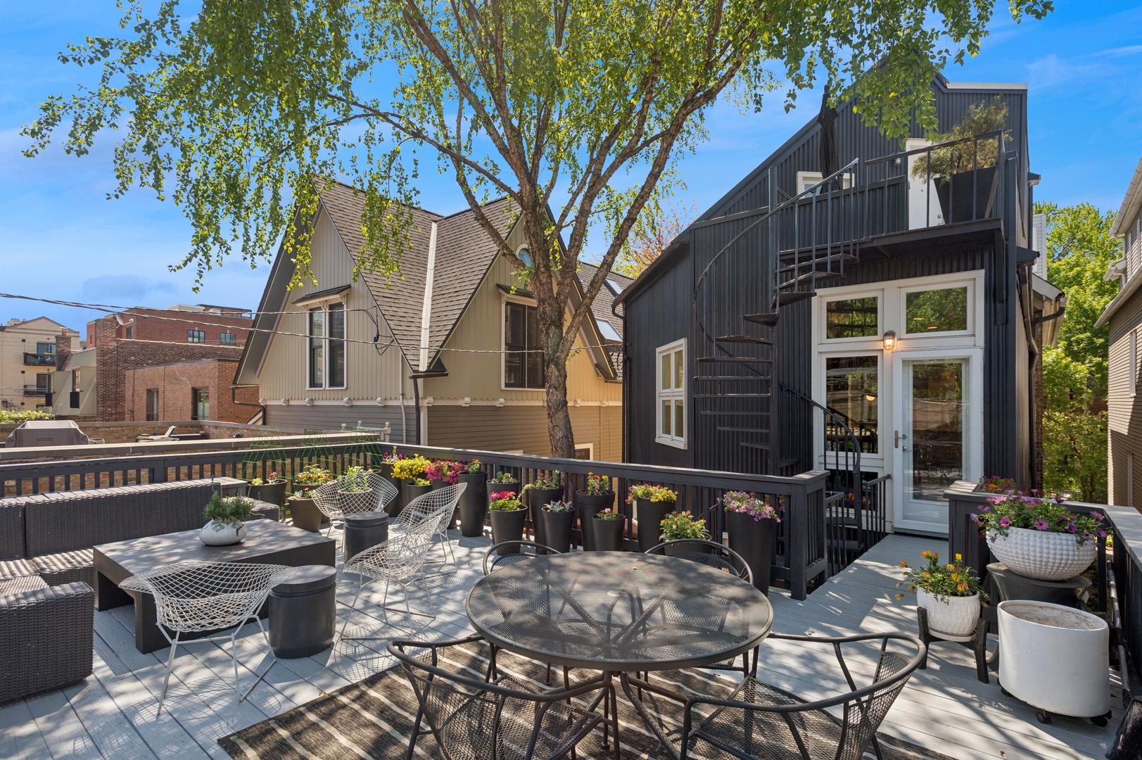 832 West Wolfram Street Chicago, IL 60657 - Photo 43 of 51 a view of a patio with couches table and chairs and potted plants