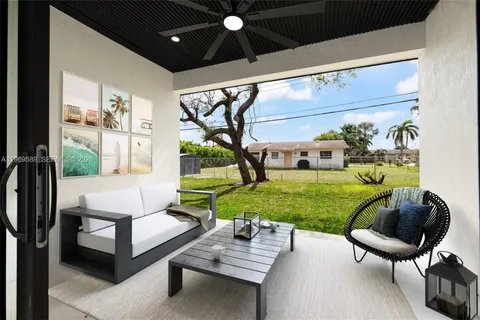 a view of a patio with chairs and a yard