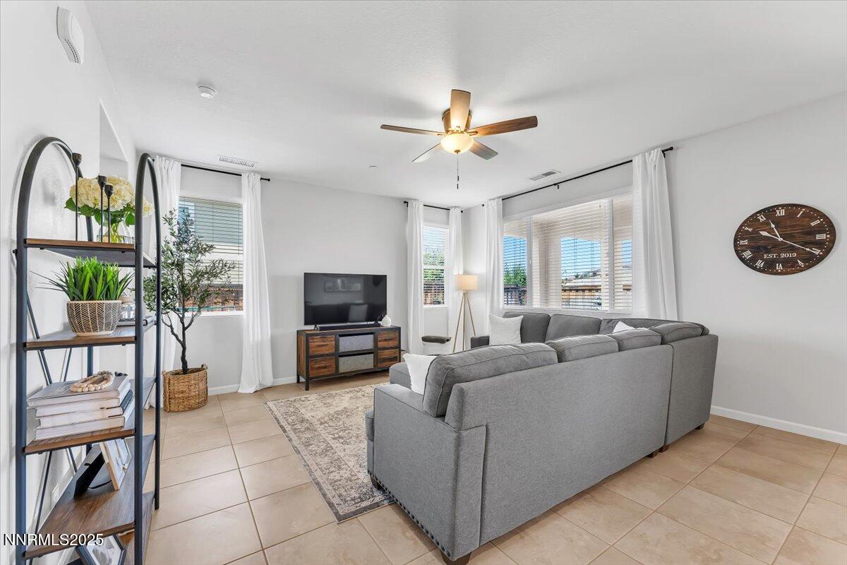2642 Alessandro Court Sparks, NV 89434 - Photo 11 of 52 a living room with furniture and a flat screen tv