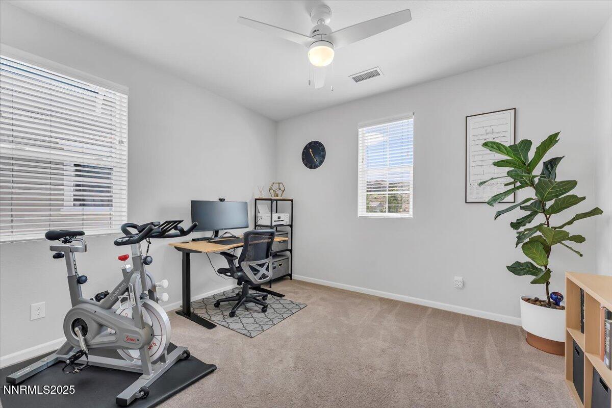 2642 Alessandro Court Sparks, NV 89434 - Photo 23 of 52 a view of a workspace with furniture and a window