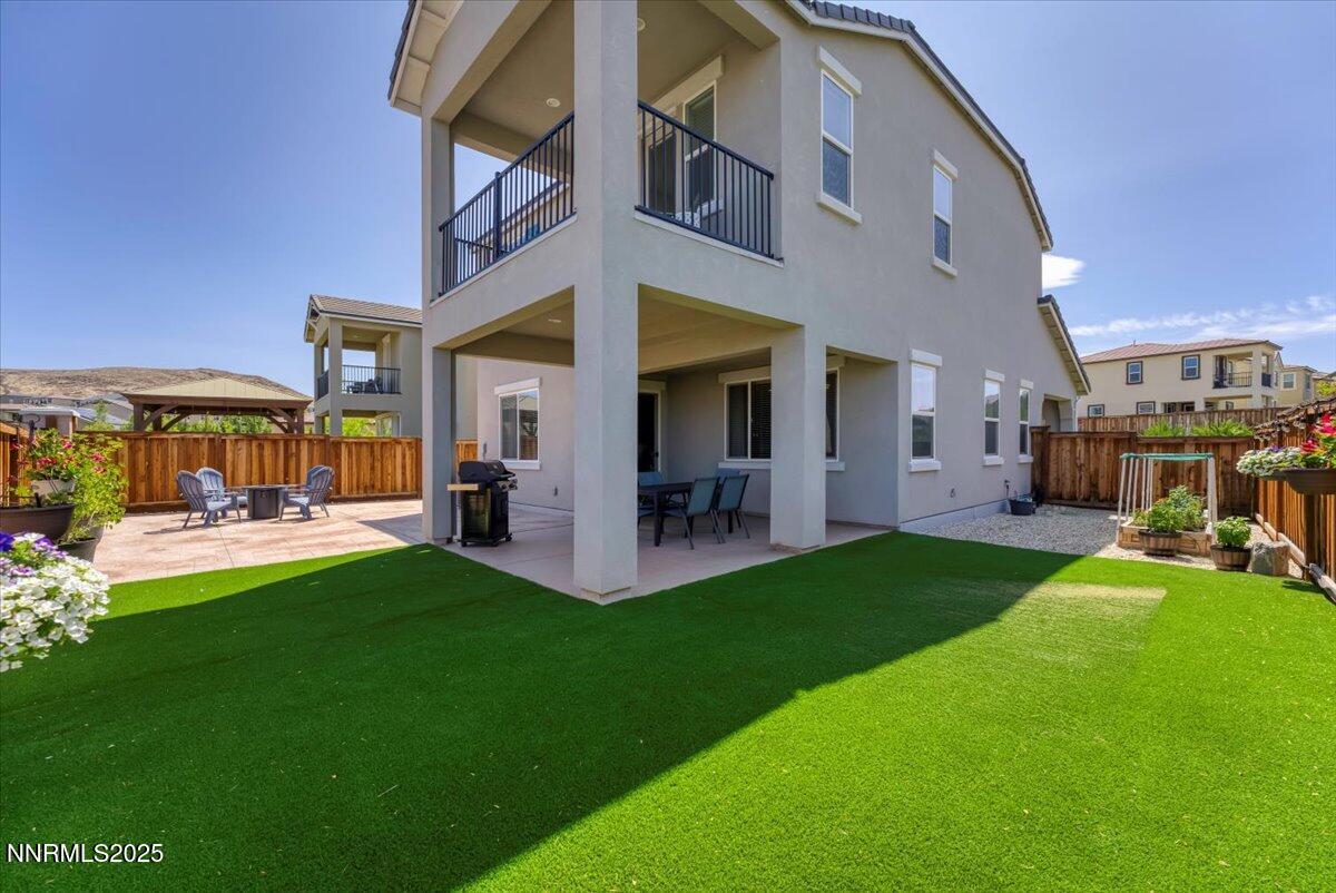 2642 Alessandro Court Sparks, NV 89434 - Photo 31 of 52 a view of a house with a yard and furniture