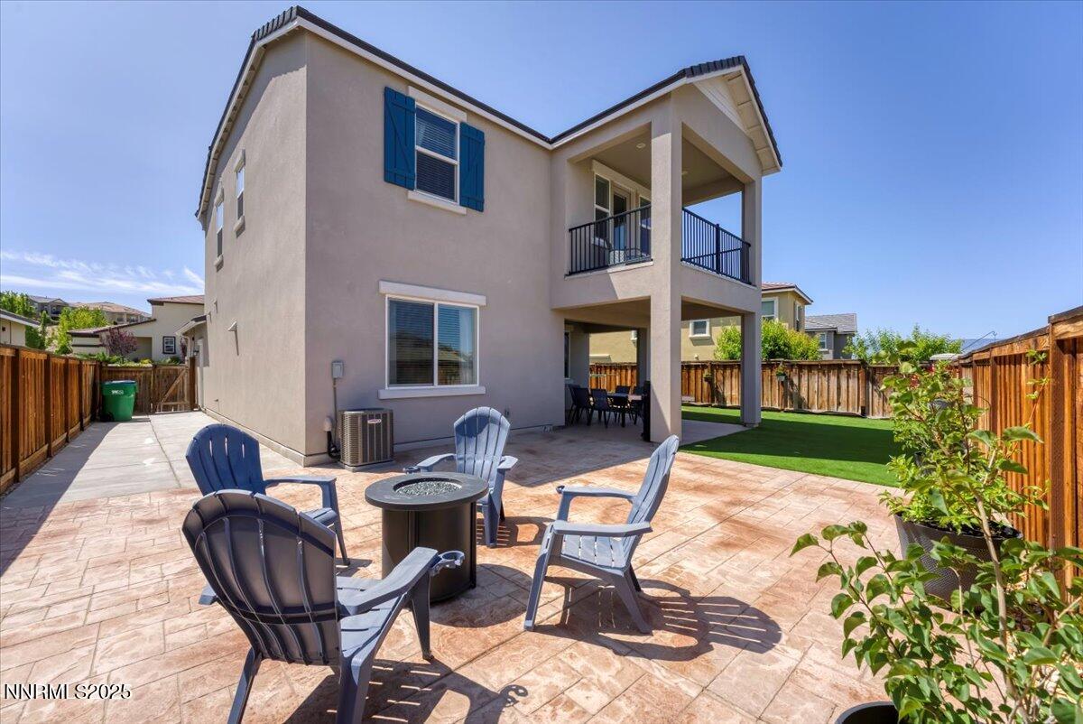 2642 Alessandro Court Sparks, NV 89434 - Photo 36 of 52 a backyard of a house with barbeque oven table and chairs