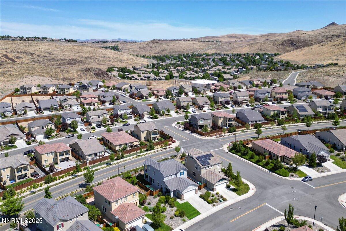 2642 Alessandro Court Sparks, NV 89434 - Photo 49 of 52 an aerial view of a city with lots of residential buildings and mountain view in back