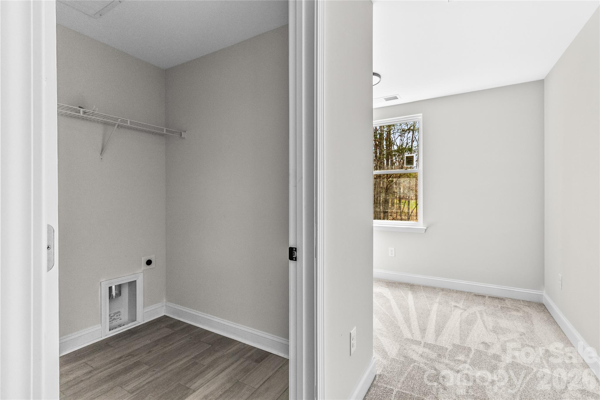 3692 Shannon Loop Denver, NC 28037 - Photo 40 of 47 a view of an empty room with wooden floor and a window
