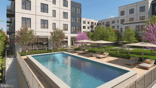 a view of swimming pool with outdoor seating