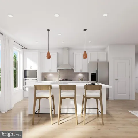 a kitchen with a table and chairs in it