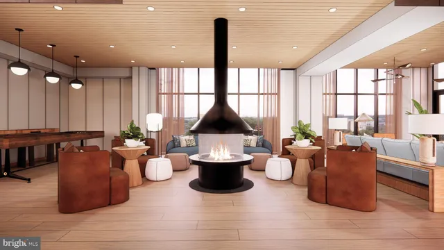 a living room with couches and a dining table with wooden floor