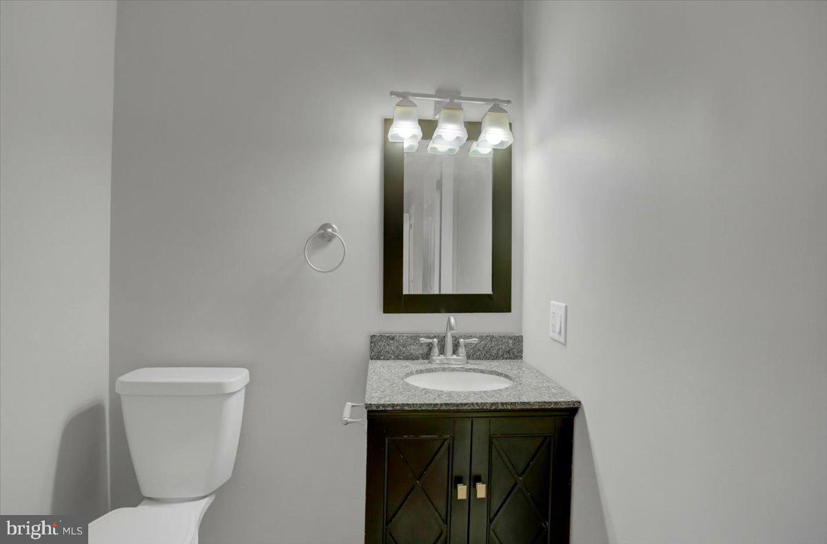 124 West Hunter Road Carlisle, PA 17015 - Photo 20 of 36 a bathroom with a toilet sink and mirror