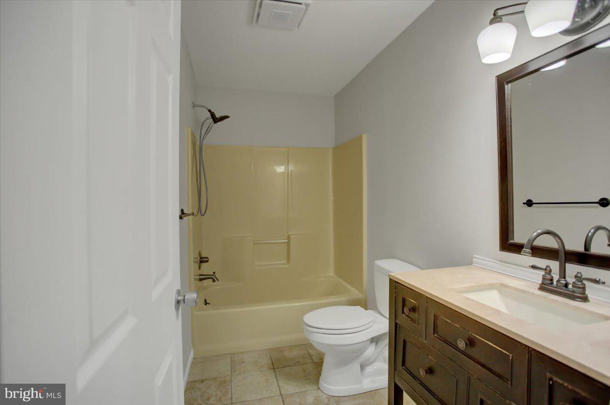124 West Hunter Road Carlisle, PA 17015 - Photo 21 of 36 a bathroom with a sink a toilet and shower