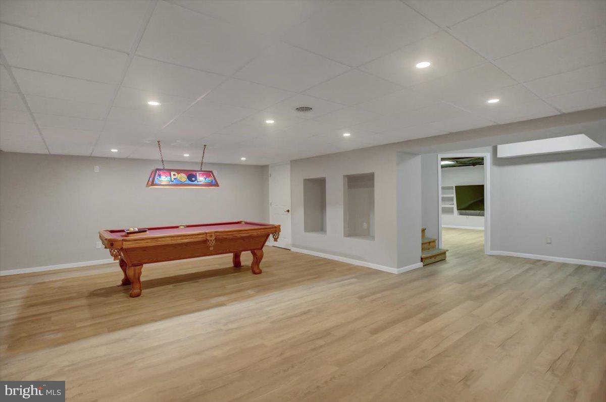 124 West Hunter Road Carlisle, PA 17015 - Photo 30 of 36 a room with wooden floor and furniture