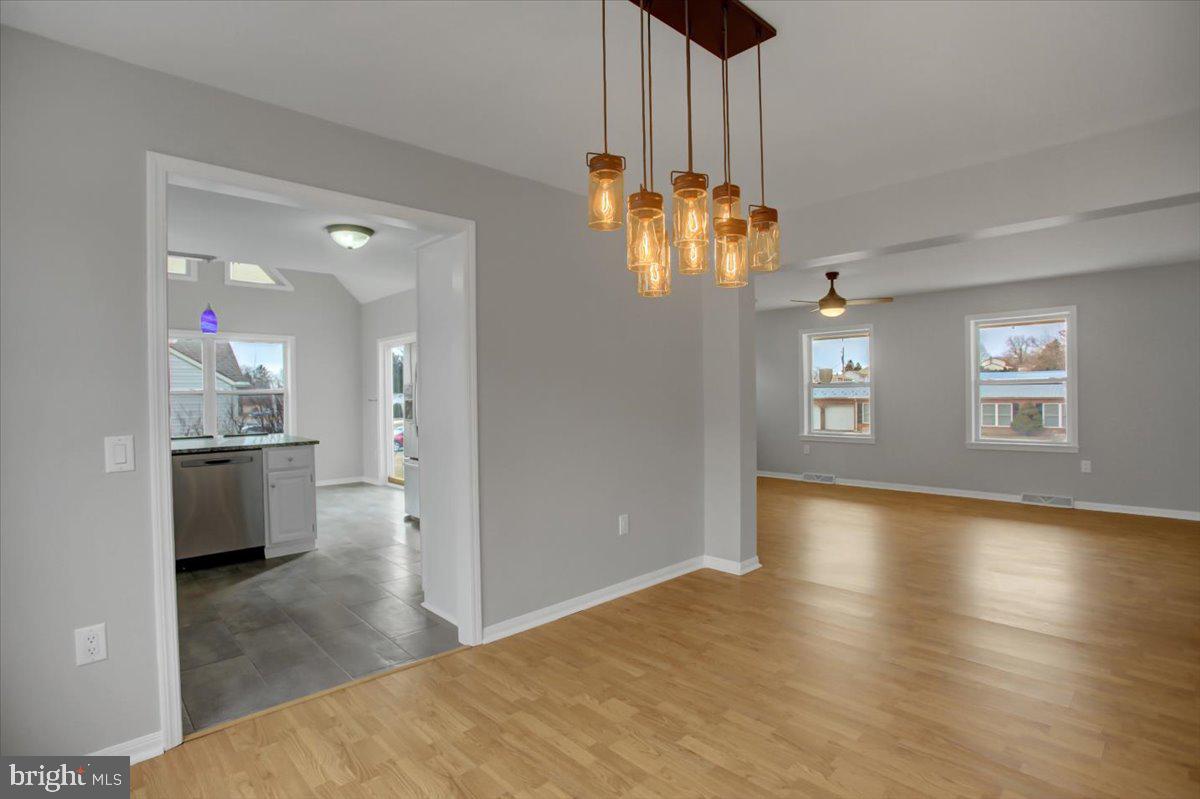 124 West Hunter Road Carlisle, PA 17015 - Photo 9 of 36 a view of a kitchen with granite countertop a refrigerator and a stove top oven