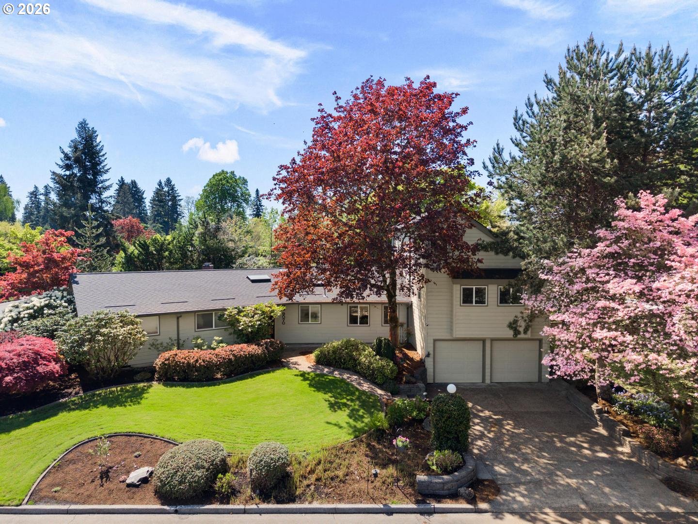 9070 Southwest Howatt Street Portland, OR 97225 - Photo 1 of 48 a front view of a house with garden