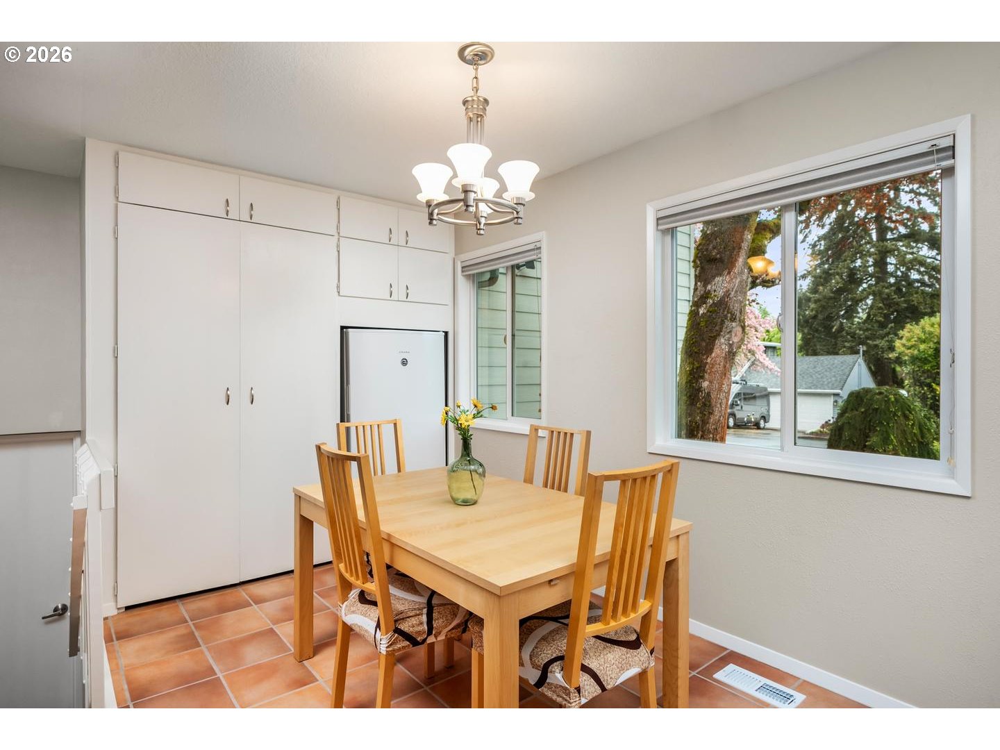 9070 Southwest Howatt Street Portland, OR 97225 - Photo 18 of 48 a view of a dining room with furniture window and outside view