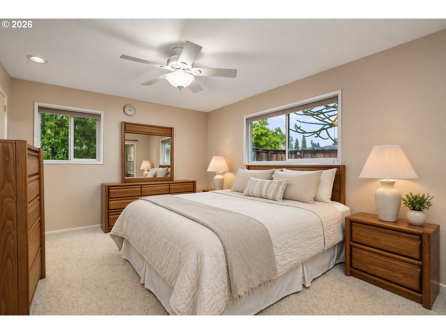 9070 Southwest Howatt Street Portland, OR 97225 - Photo 23 of 48 a bedroom with a bed and a chandelier