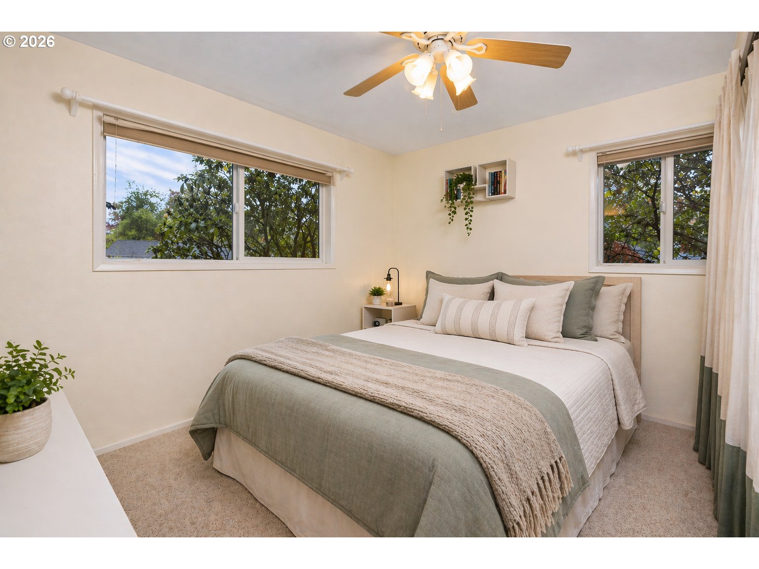 9070 Southwest Howatt Street Portland, OR 97225 - Photo 25 of 48 a bedroom with a bed and a chandelier
