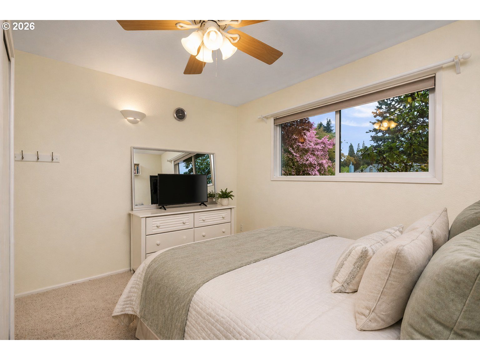9070 Southwest Howatt Street Portland, OR 97225 - Photo 26 of 48 a bedroom with a large bed and a flat screen tv