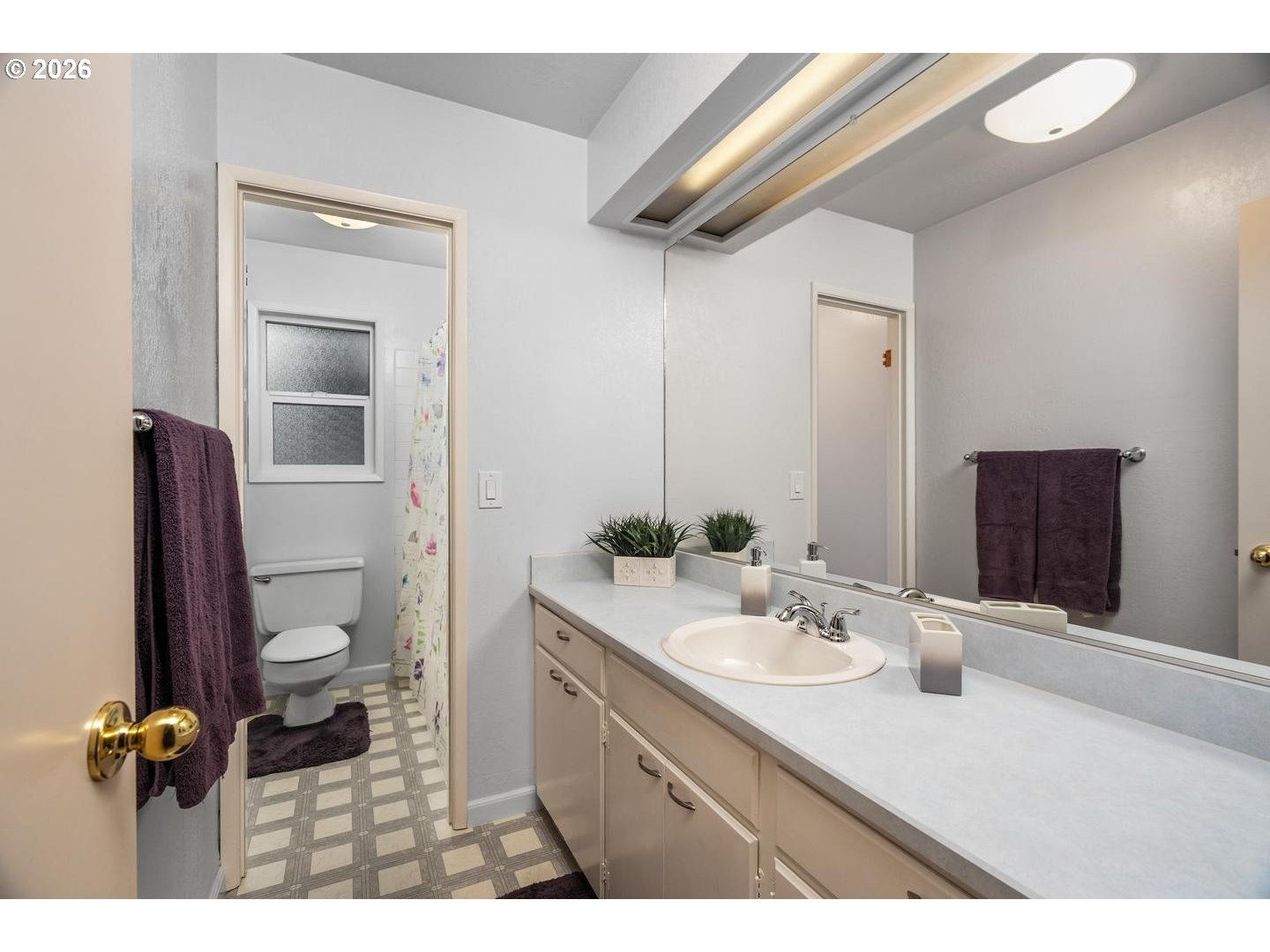 9070 Southwest Howatt Street Portland, OR 97225 - Photo 29 of 48 a bathroom with a granite countertop sink toilet and mirror
