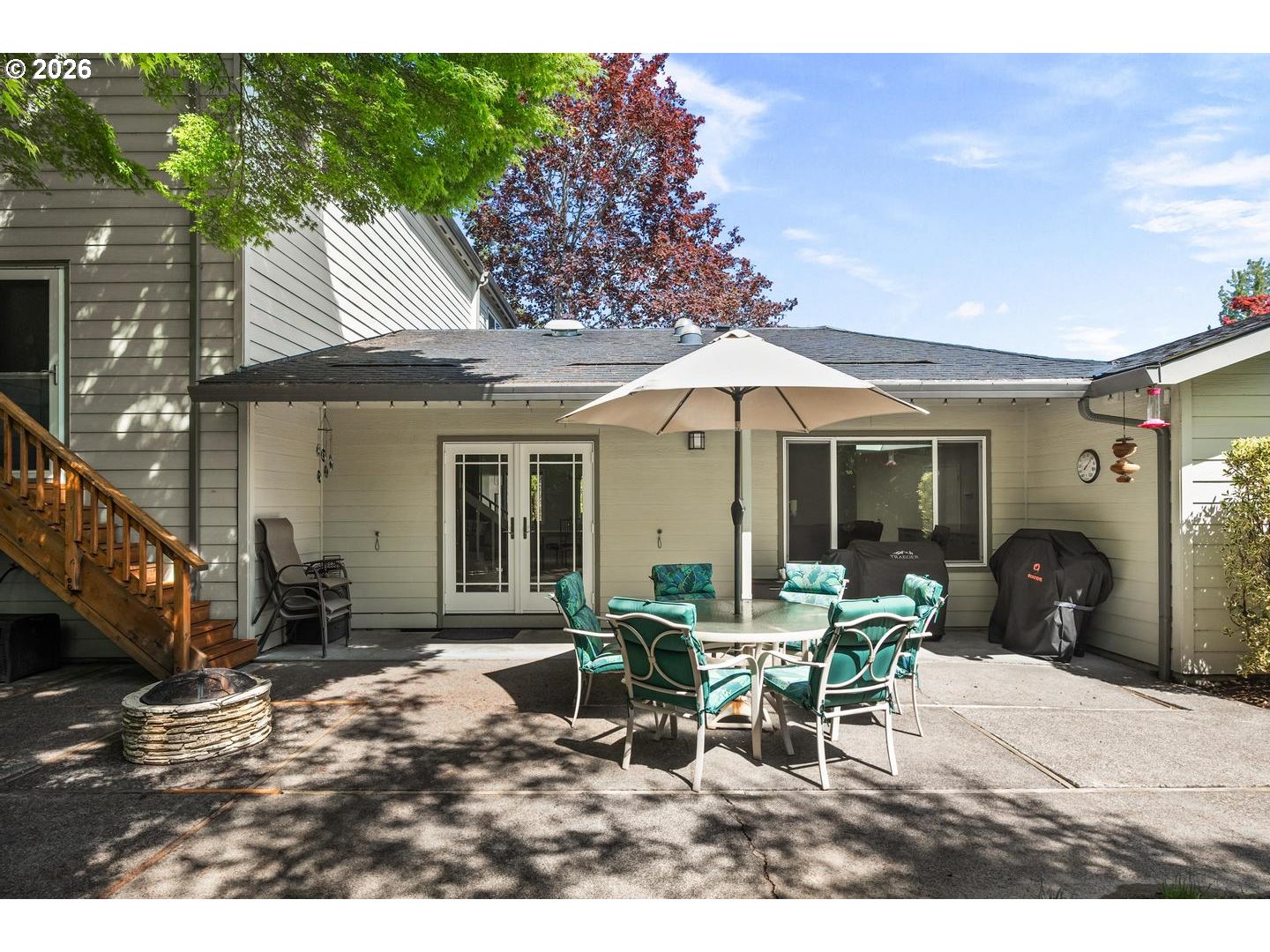 9070 Southwest Howatt Street Portland, OR 97225 - Photo 37 of 48 a patio with table and chairs