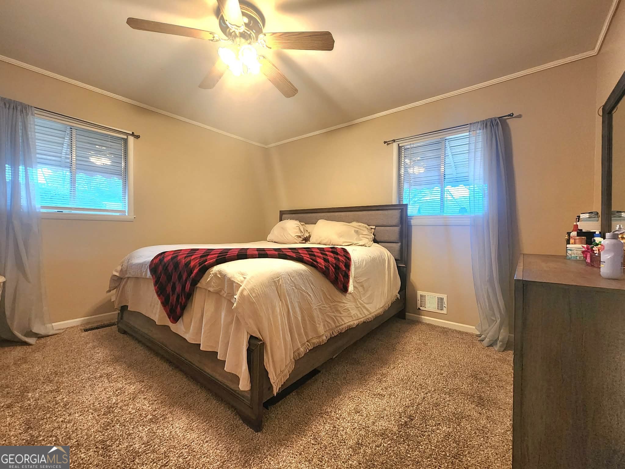 1026 Jackson Road Griffin, GA 30223 - Photo 11 of 21 a bed sitting in a bedroom next to a window