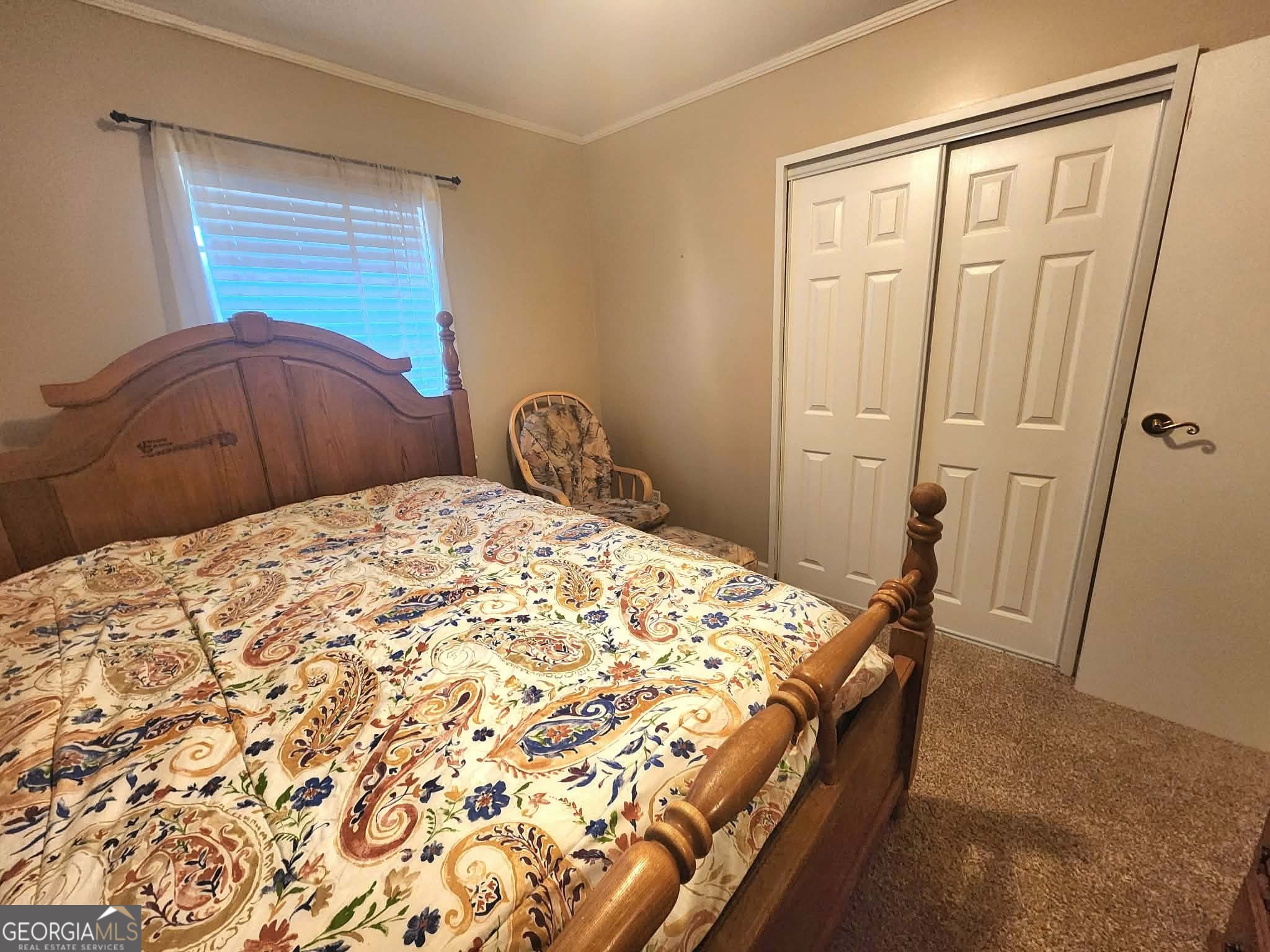 1026 Jackson Road Griffin, GA 30223 - Photo 13 of 21 a bedroom with a bed and a mirror