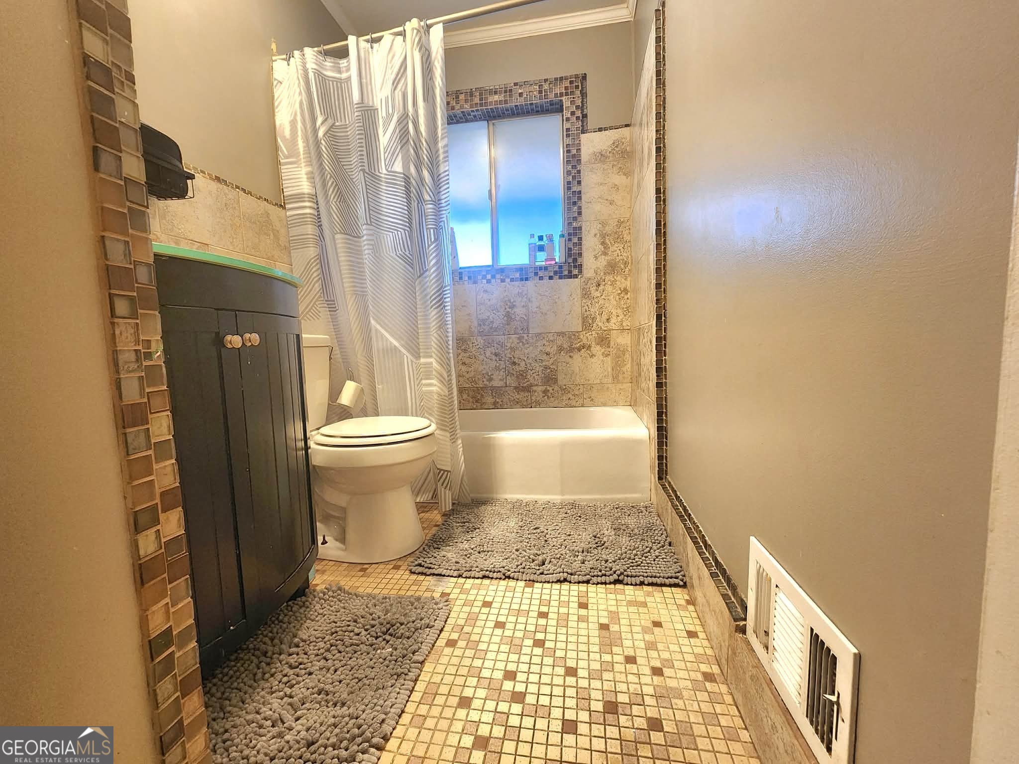 1026 Jackson Road Griffin, GA 30223 - Photo 18 of 21 a bathroom with a sink and a toilet