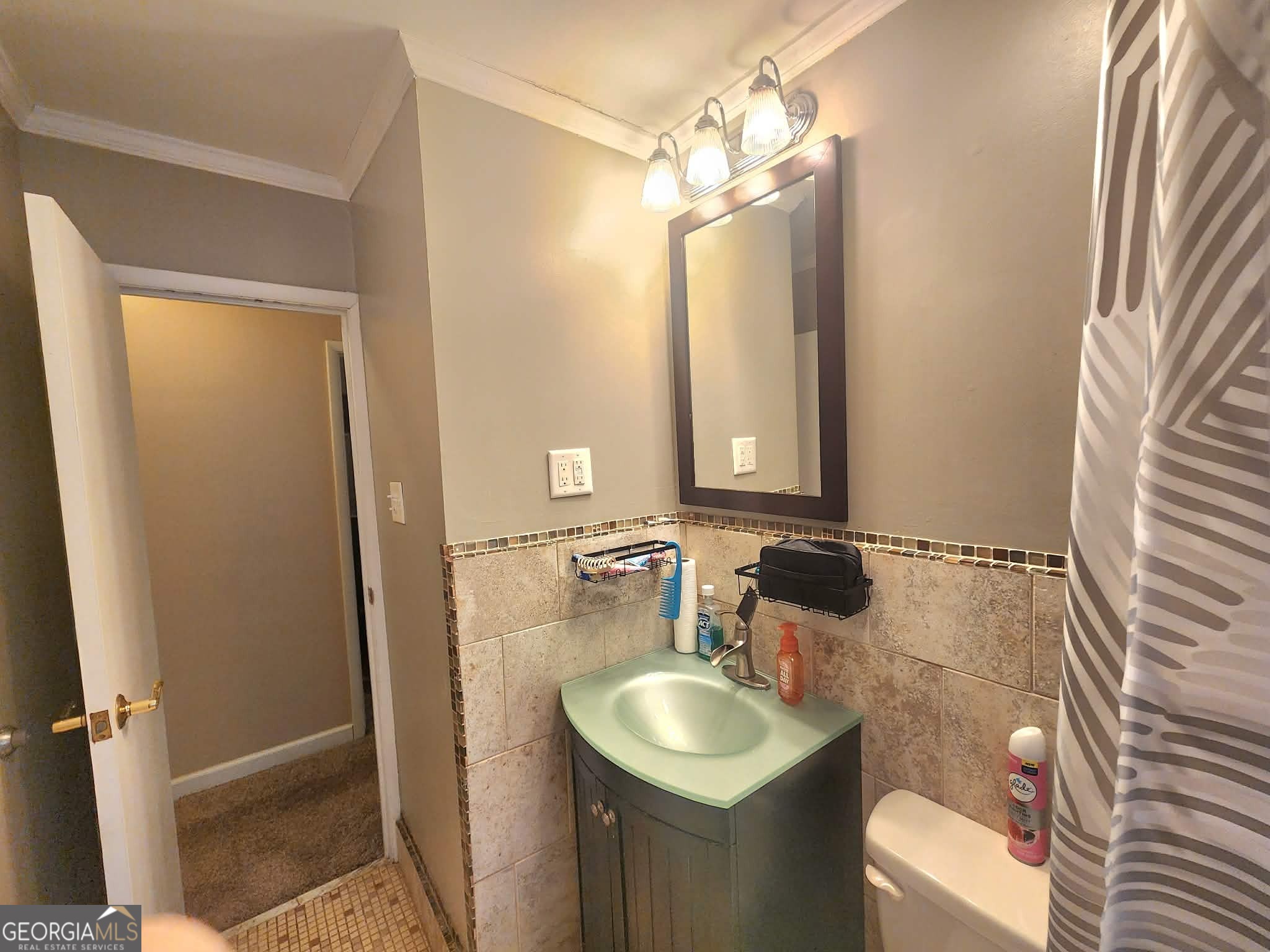 1026 Jackson Road Griffin, GA 30223 - Photo 19 of 21 a bathroom with a sink and a mirror